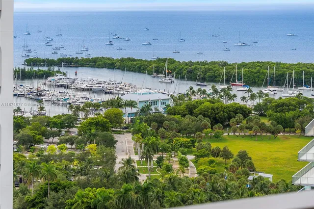 a living room with furniture and a book shelf