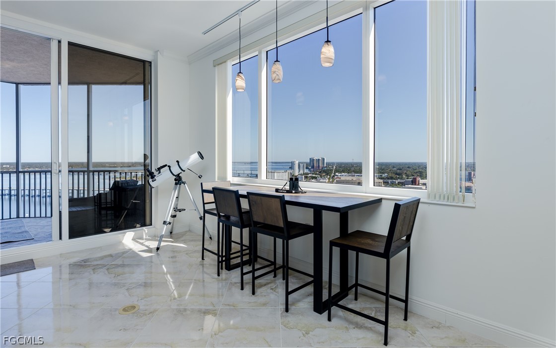 2090 West First Street, Unit J2510 Fort Myers, FL 33901 - Photo 12 of 50 a dining room with furniture and window