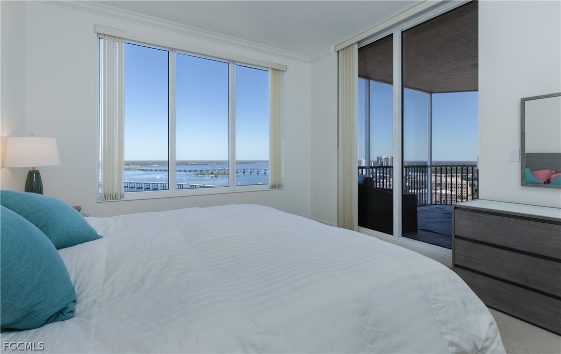 2090 West First Street, Unit J2510 Fort Myers, FL 33901 - Photo 13 of 50 a bedroom with a bed and a window