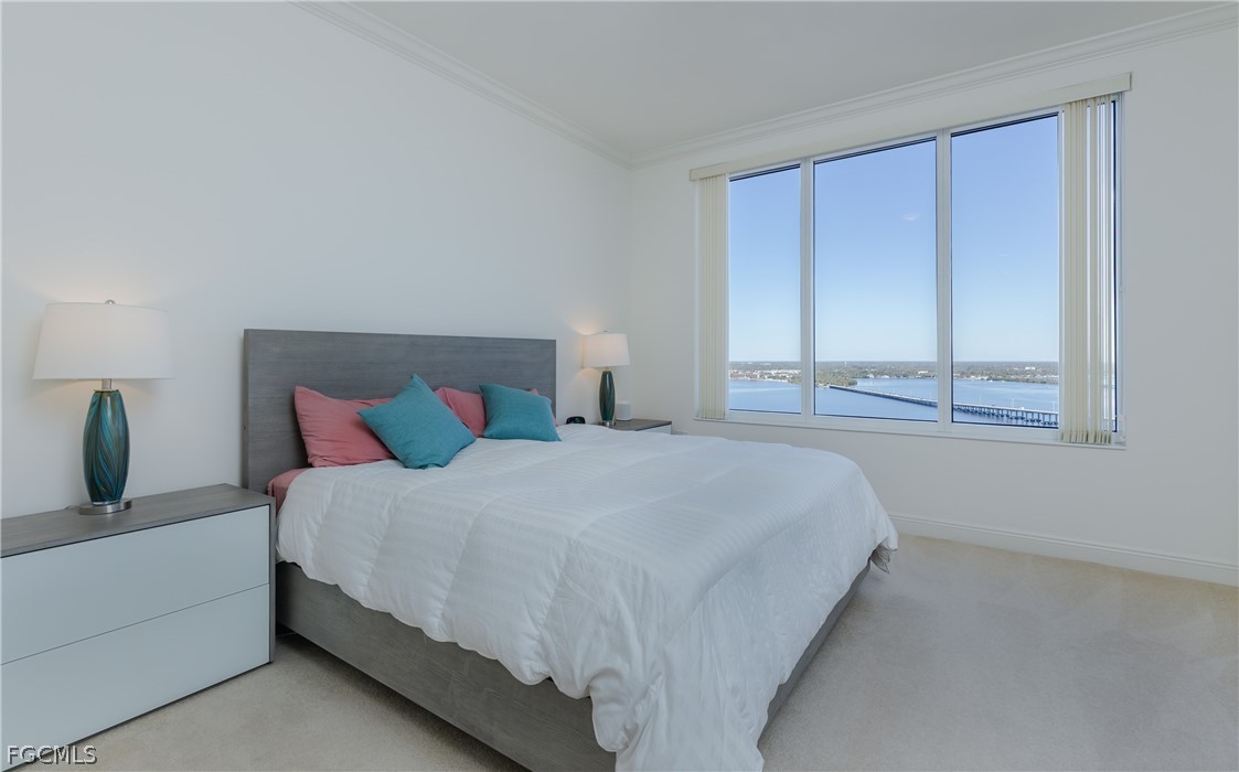 2090 West First Street, Unit J2510 Fort Myers, FL 33901 - Photo 14 of 50 a bedroom with a bed and window