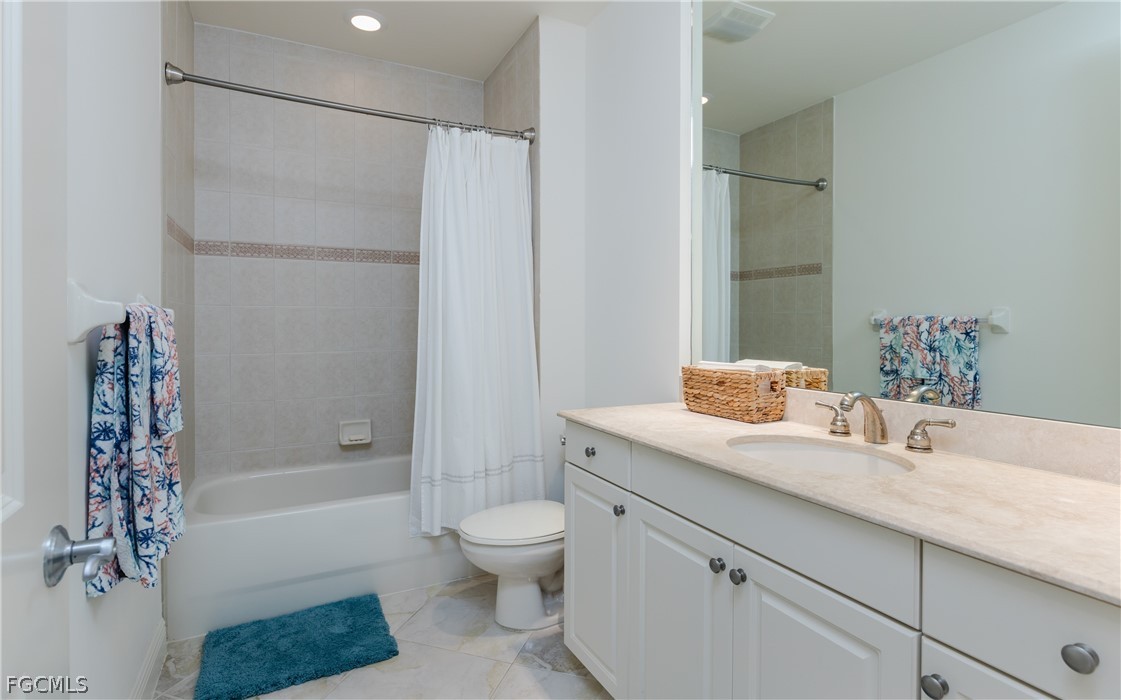 2090 West First Street, Unit J2510 Fort Myers, FL 33901 - Photo 20 of 50 a bathroom with a granite countertop sink a toilet and shower