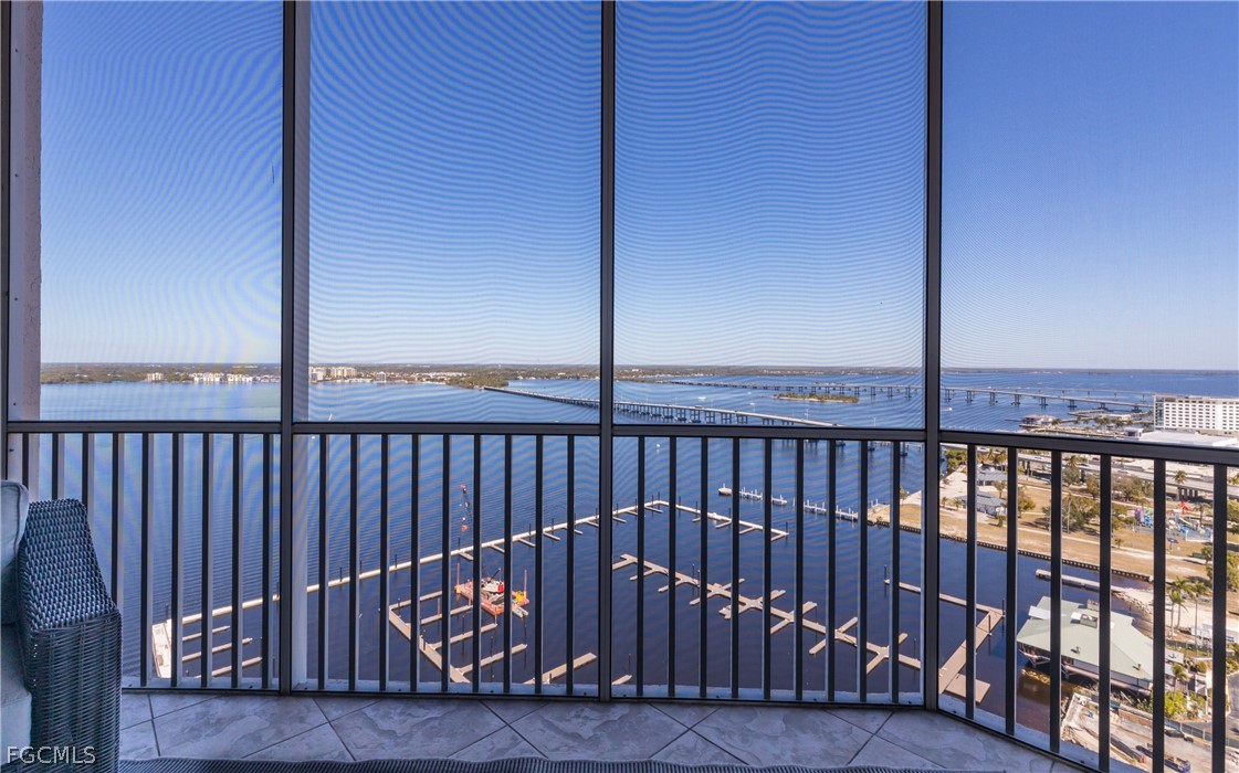 2090 West First Street, Unit J2510 Fort Myers, FL 33901 - Photo 24 of 50 a view of balcony with a floor to ceiling window and wooden floor