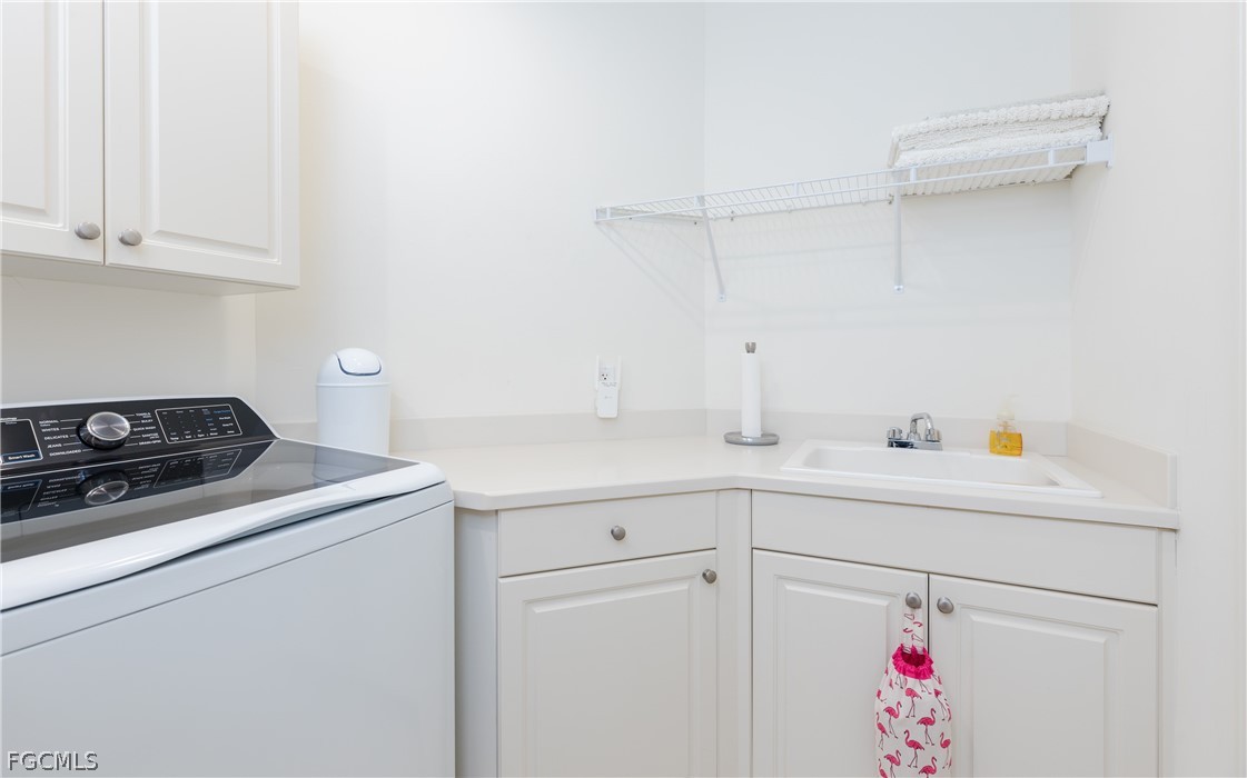 2090 West First Street, Unit J2510 Fort Myers, FL 33901 - Photo 27 of 50 a utility room with sink dryer and washer