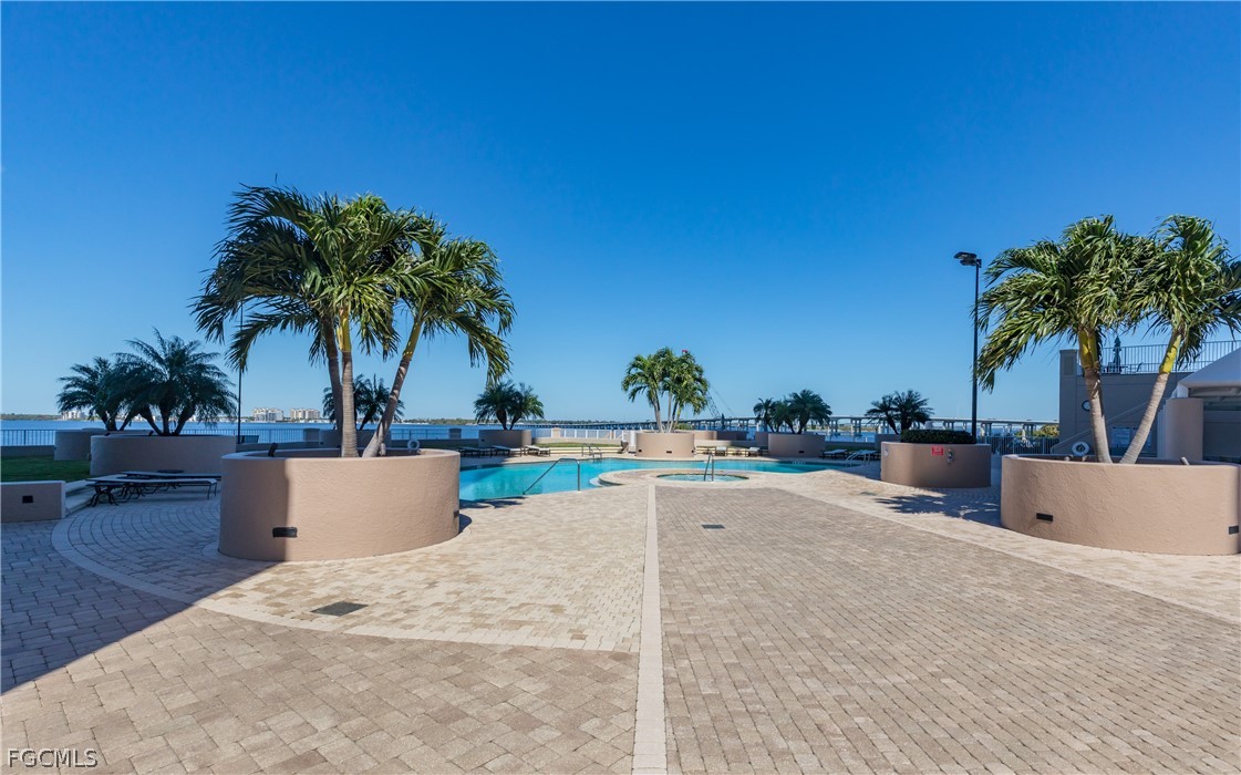 2090 West First Street, Unit J2510 Fort Myers, FL 33901 - Photo 29 of 50 swimming pool view with a garden