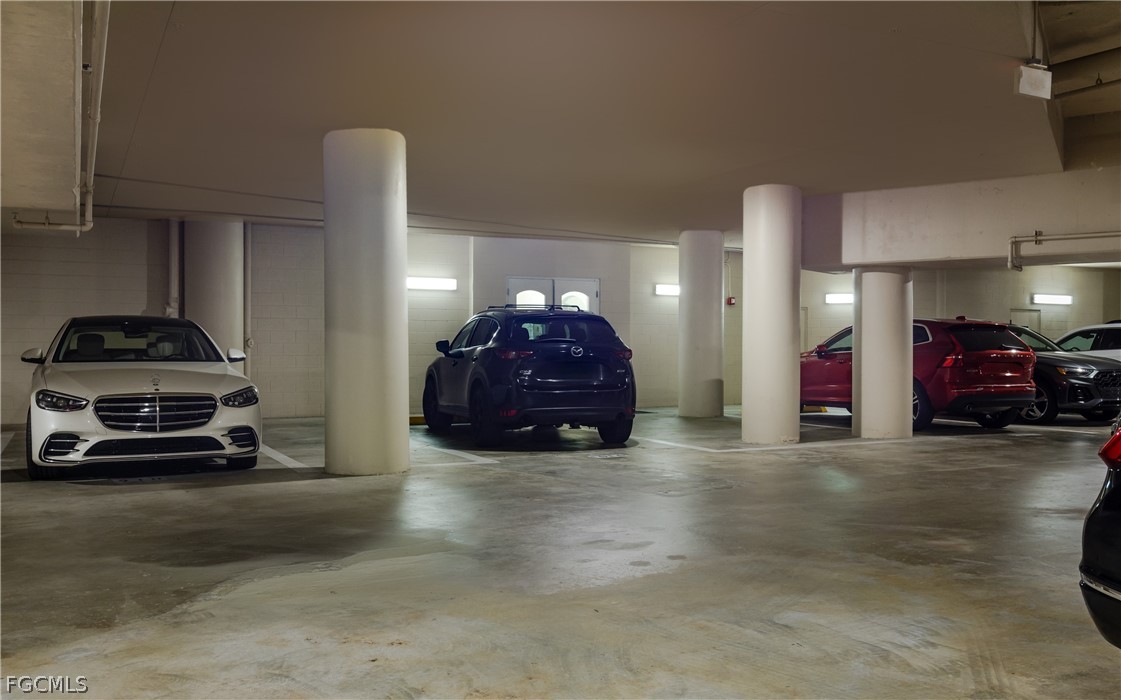 2090 West First Street, Unit J2510 Fort Myers, FL 33901 - Photo 43 of 50 a view of a cars parked in back of a building