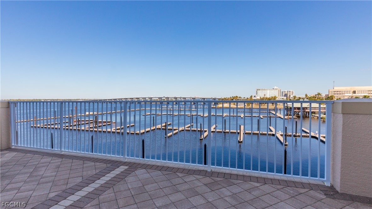 2090 West First Street, Unit J2510 Fort Myers, FL 33901 - Photo 45 of 50 a view of a roof deck with wooden fence