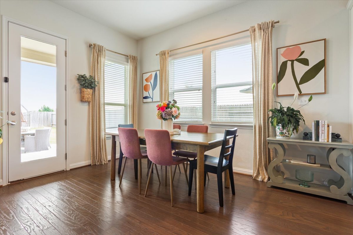 424 Millard Street Georgetown, TX 78628 - Photo 12 of 37 Hardwood floors and a sun-filled dining area provide an ideal space for meals and gatherings.