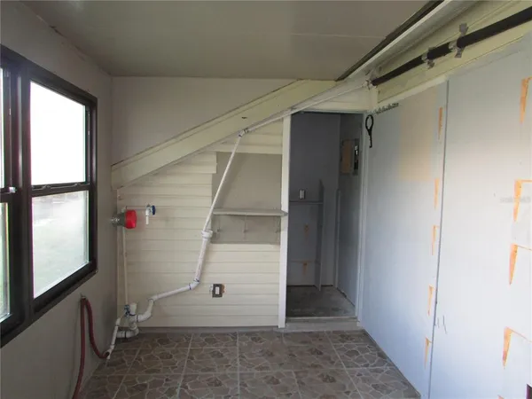 a view of an empty room with a window