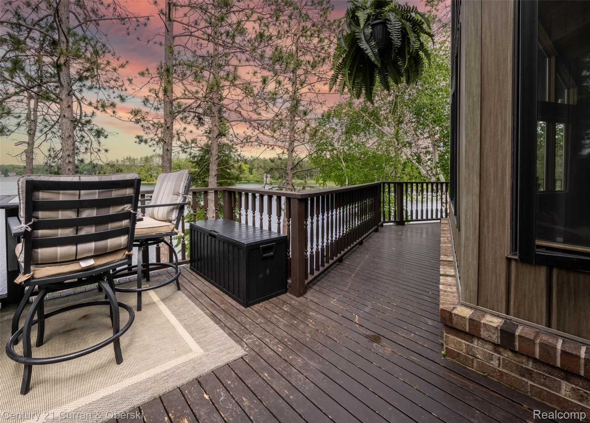 8775 Winding Rdg Drive Millersburg, MI 49759 - Photo 38 of 53 Expansive outdoor deck featuring dark wood-finish flooring and a dark wood railing