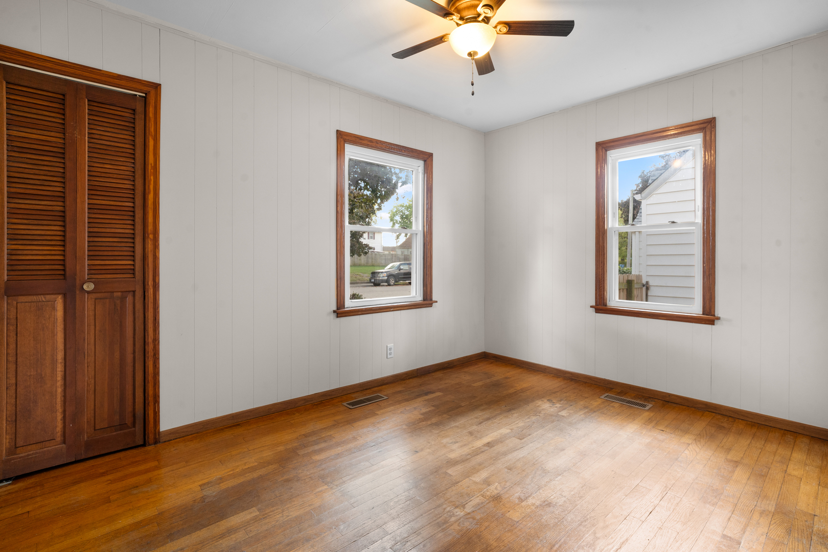 1149 Wilson Drive Kankakee, IL 60901 - Photo 13 of 23 a view of an empty room with a window and wooden floor