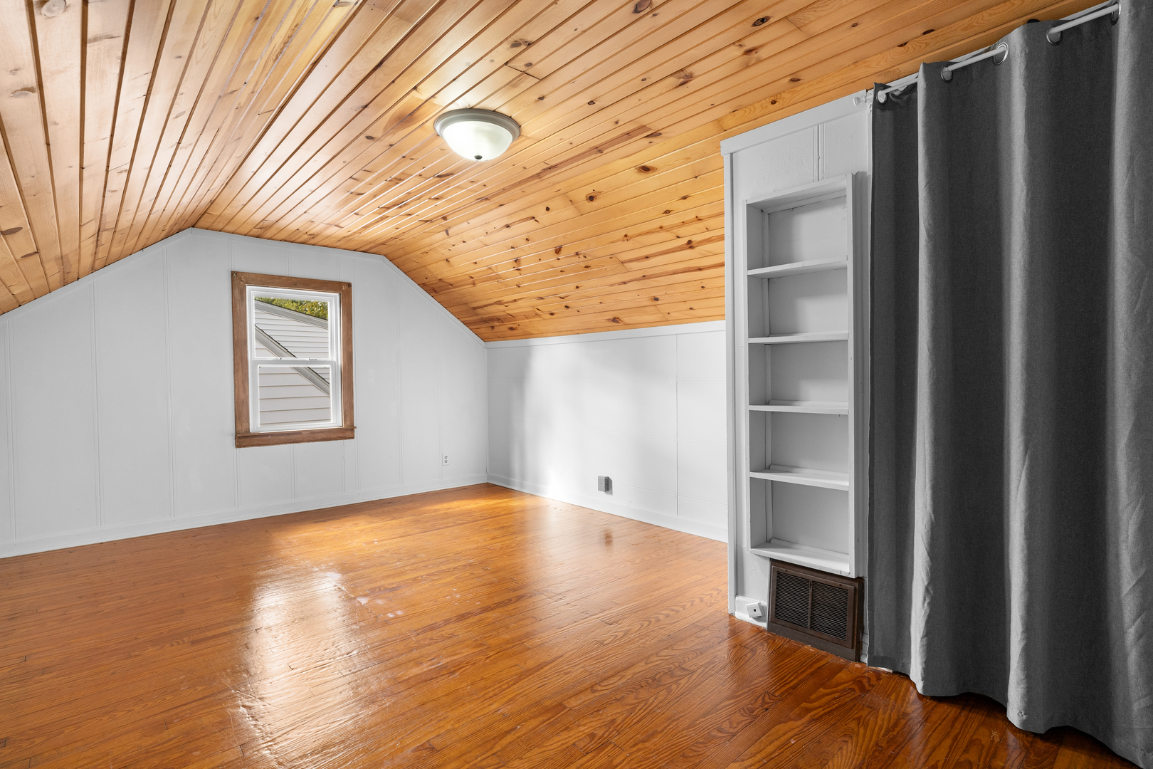 1149 Wilson Drive Kankakee, IL 60901 - Photo 16 of 23 a view of an empty room with wooden floor and a window