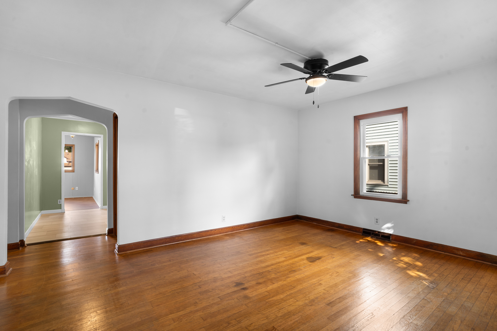 1149 Wilson Drive Kankakee, IL 60901 - Photo 2 of 23 wooden floor in an empty room with a window