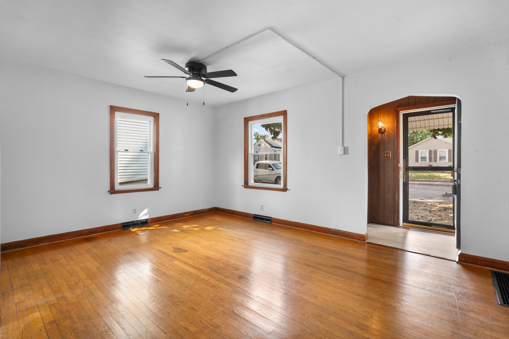 1149 Wilson Drive Kankakee, IL 60901 - Photo 3 of 23 a view of an empty room with window and wooden floor