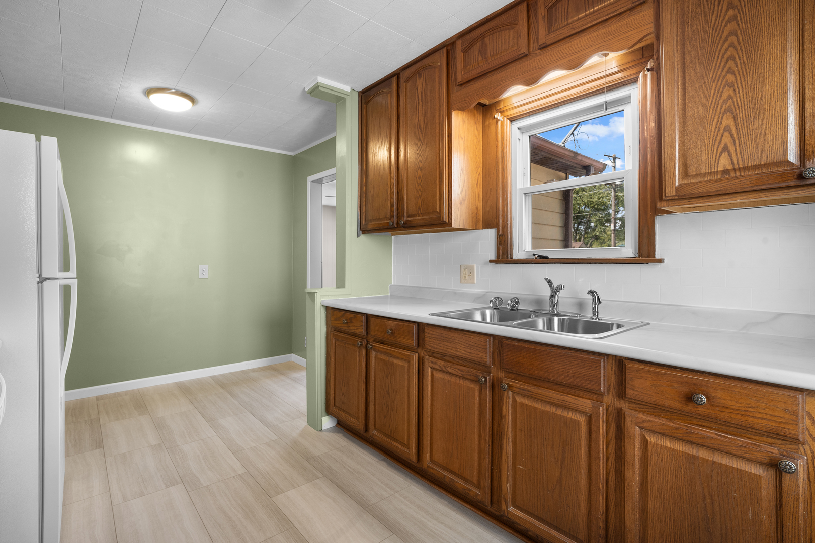 1149 Wilson Drive Kankakee, IL 60901 - Photo 9 of 23 a bathroom with a sink and a mirror