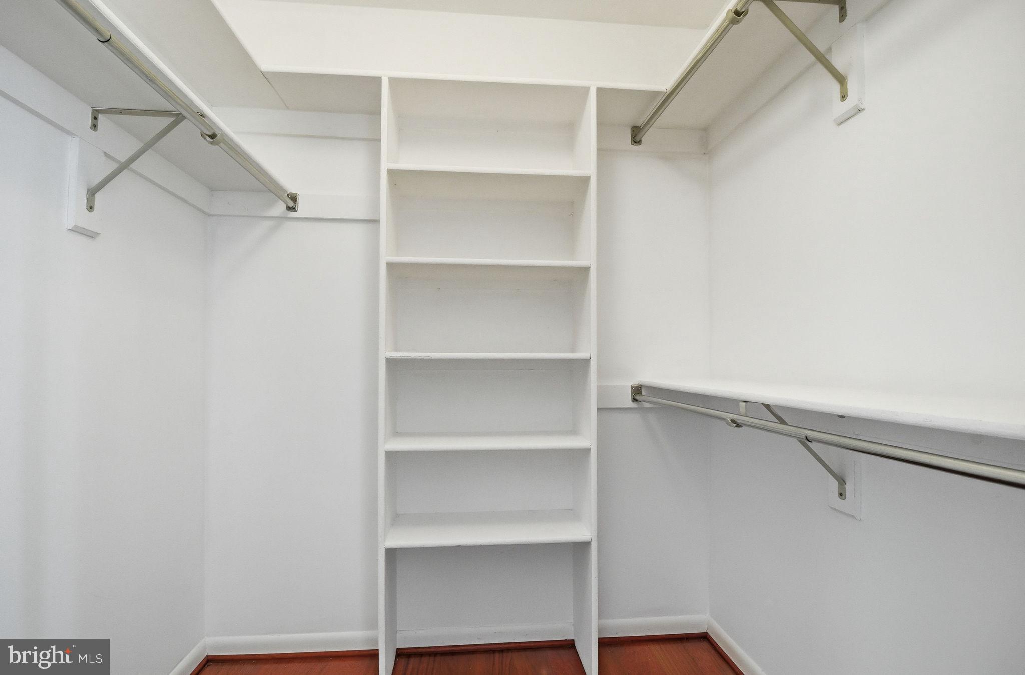 10995 Thrush Ridge Road Reston, VA 20191 - Photo 17 of 30 a view of walk in closet with empty racks