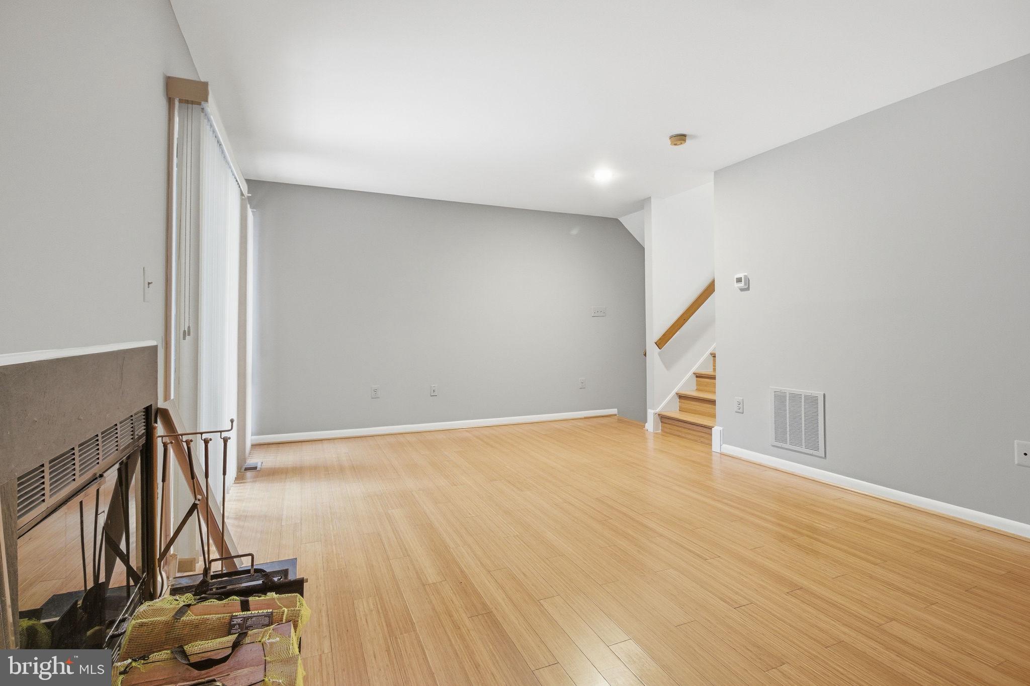 10995 Thrush Ridge Road Reston, VA 20191 - Photo 26 of 30 a view of an empty room with wooden floor and a window