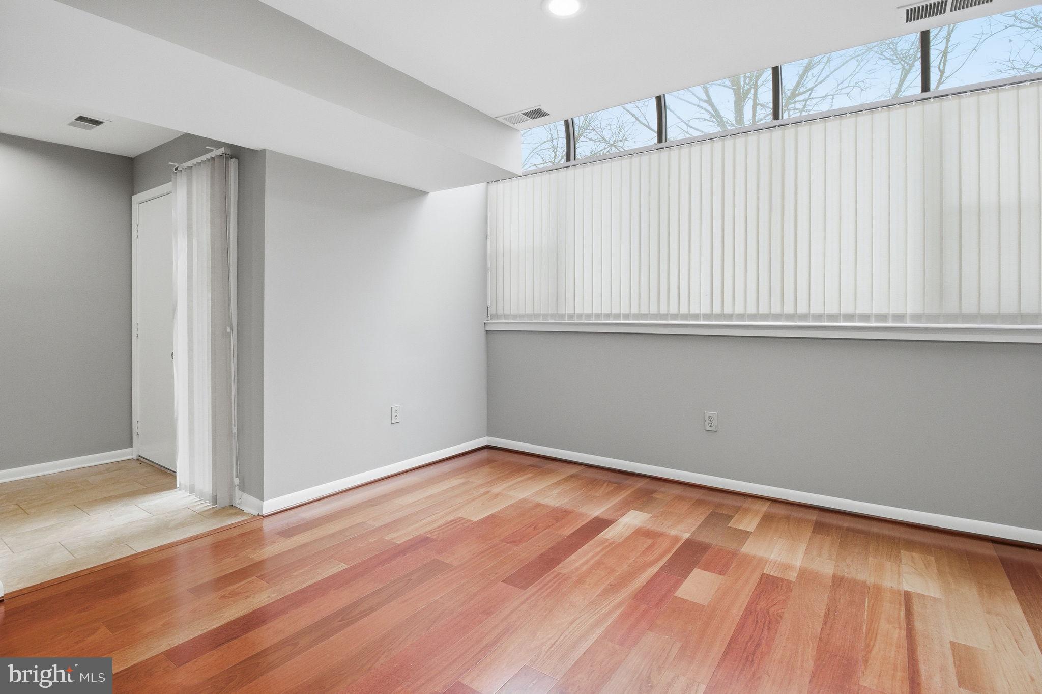 10995 Thrush Ridge Road Reston, VA 20191 - Photo 4 of 30 a view of an empty room with wooden floor