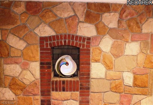 33699 Pinetree Road Cleveland, OH 44124 - Photo 8 of 20 View of the stone hearth in Kitchen.