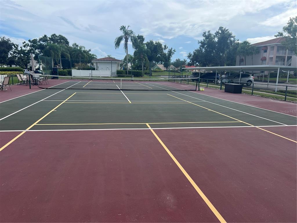 6501 Stone River Road, Unit 309 Bradenton, FL 34203 - Photo 12 of 33 a view of a tennis court
