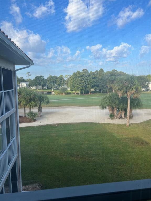 6501 Stone River Road, Unit 309 Bradenton, FL 34203 - Photo 15 of 33 a view of a lake with a big yard