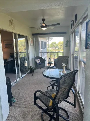 a view of a livingroom with furniture and a table