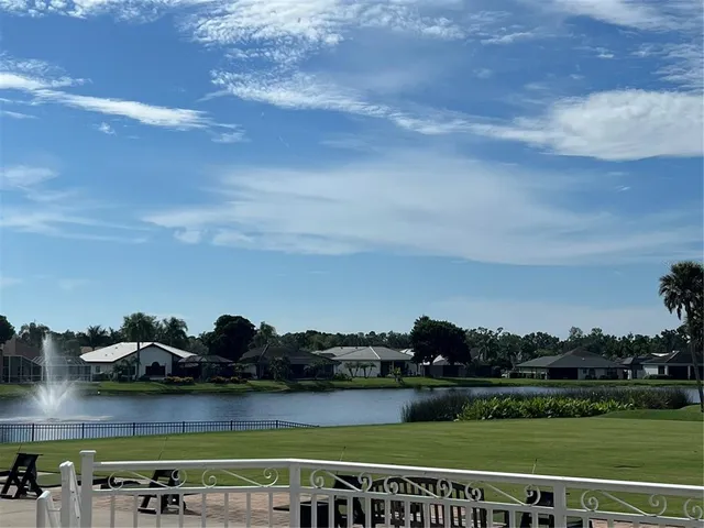 a view of a lake with a big yard