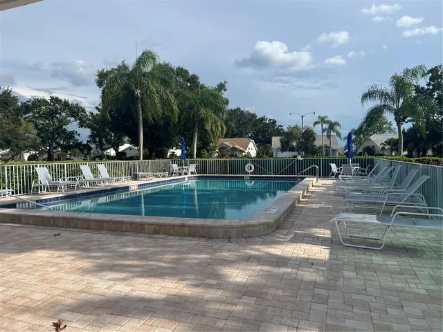 a view of a swimming pool with a yard
