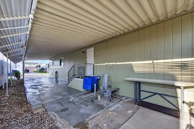 a living room with furniture a flat screen tv and a table