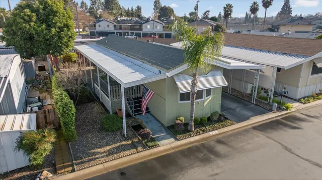 an aerial view of a house with a garden and plants