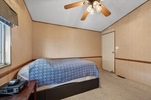 an aerial view of houses with yard