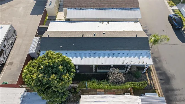 a front view of a house with a yard table and chairs