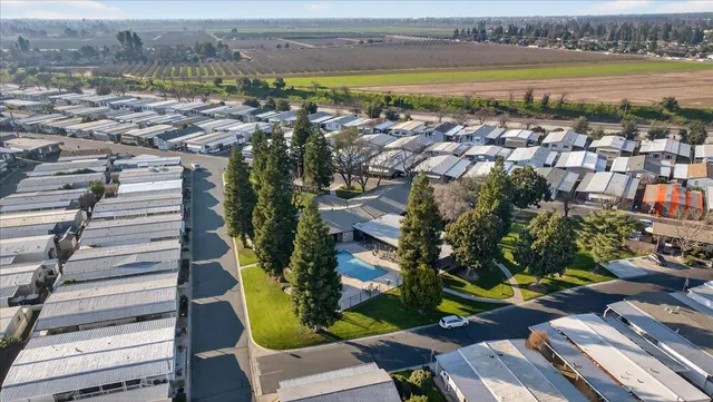 a large kitchen with stainless steel appliances lots of counter space and a sink