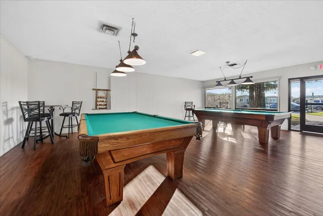 a view of a patio with couches chair and potted plants
