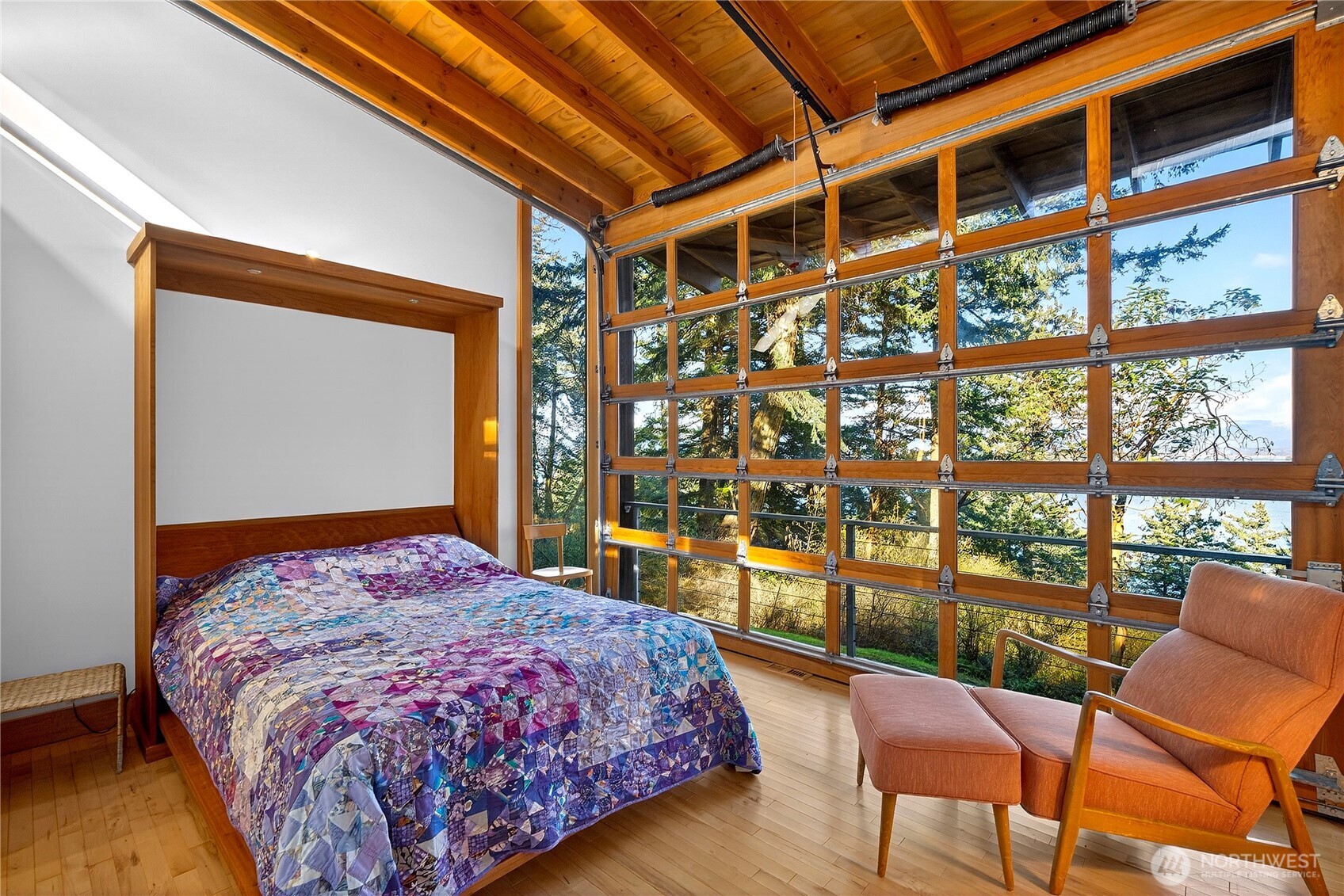7457 Holiday Boulevard Anacortes, WA 98221 - Photo 16 of 23 a bedroom with a bed and a chair