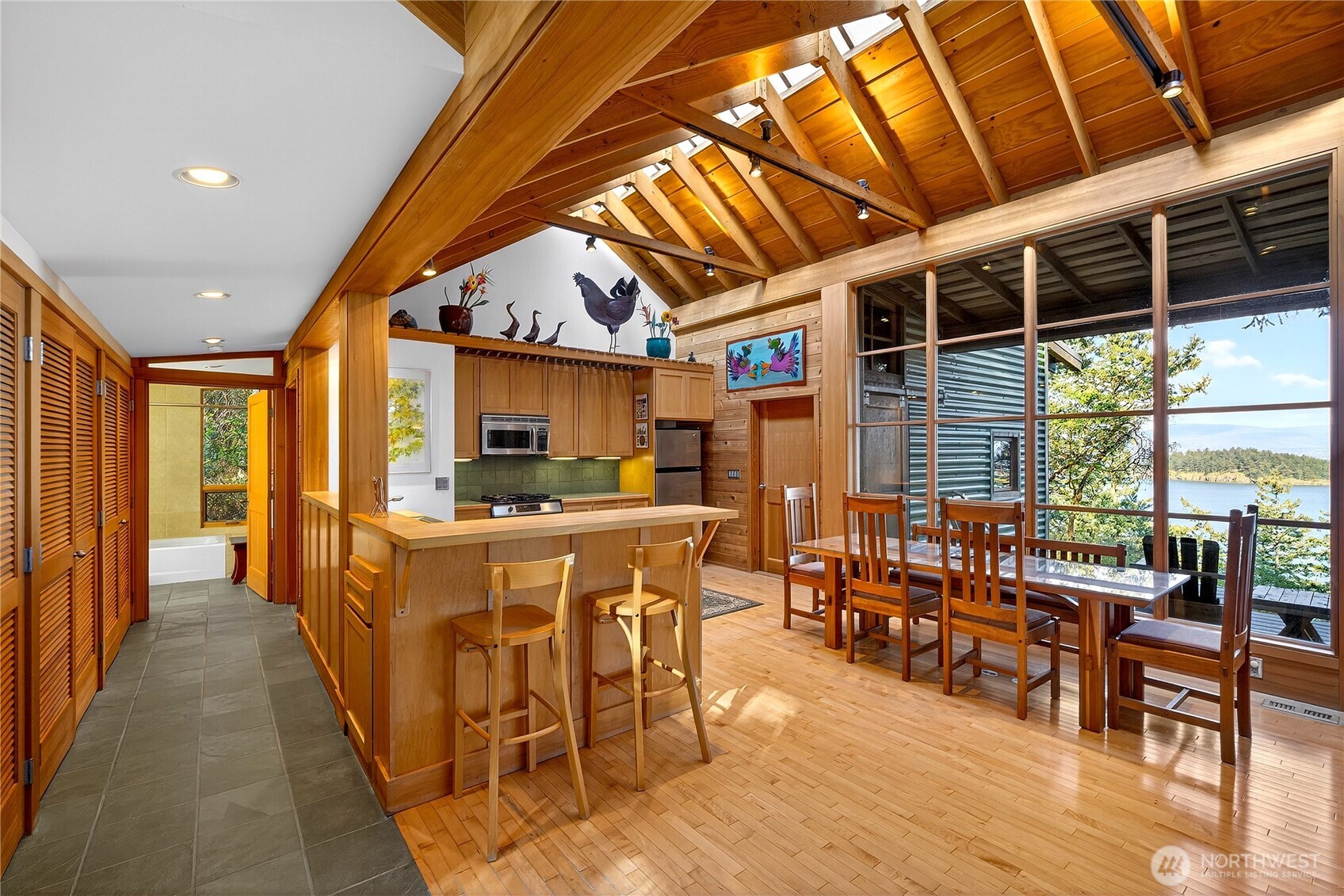 7457 Holiday Boulevard Anacortes, WA 98221 - Photo 4 of 23 a view of a dining room with furniture window and outside view