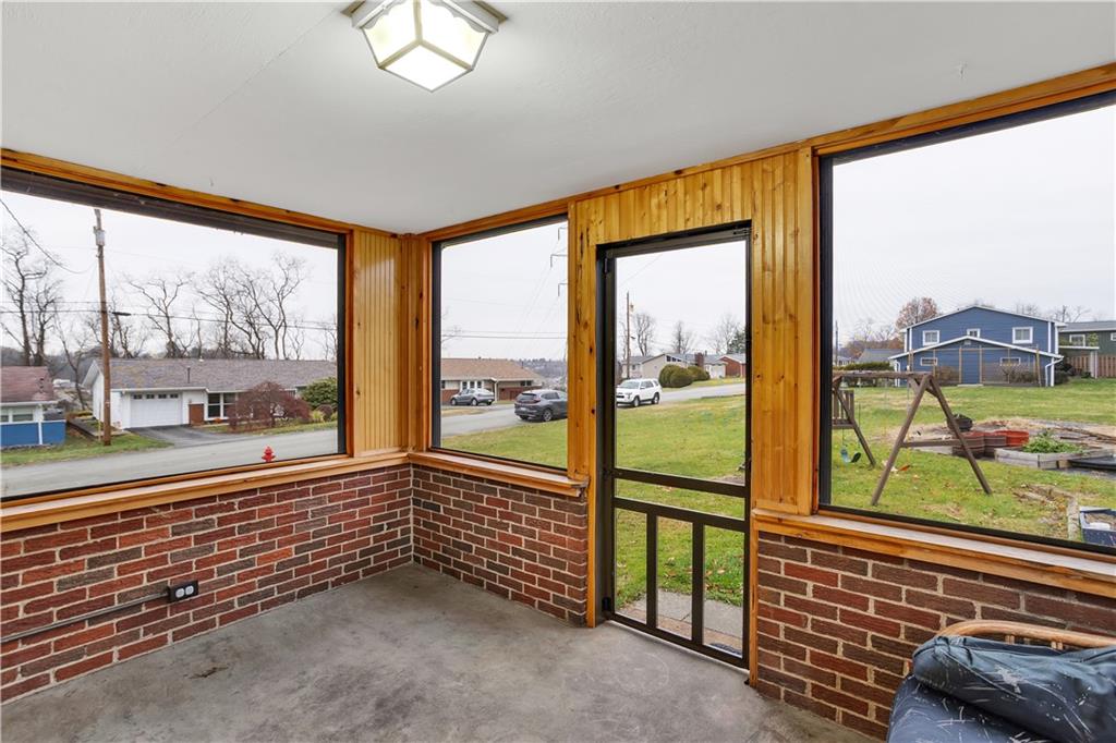 911 Quaker Drive Irwin, PA 15642 - Photo 15 of 35 Screened in porch for additonal main floor living.
