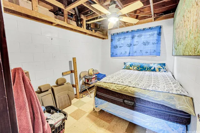 a bed room with a bed and a chair