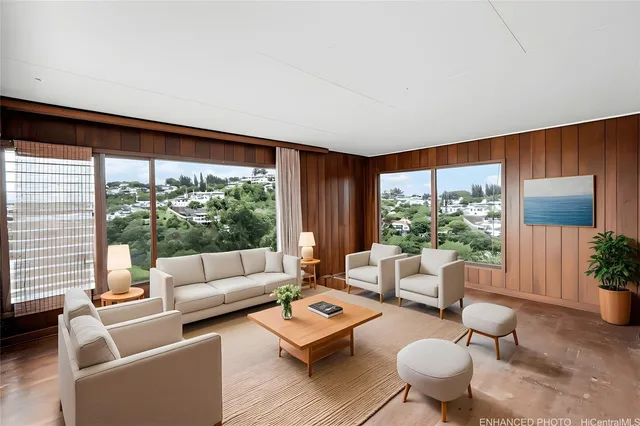 a living room with furniture and a large window