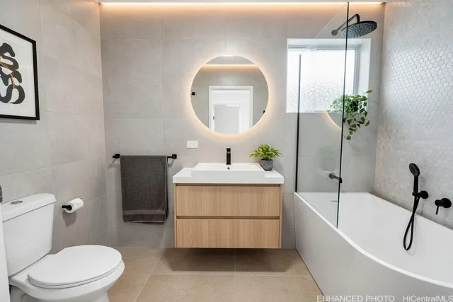a bathroom with a sink a bathtub and a toilet