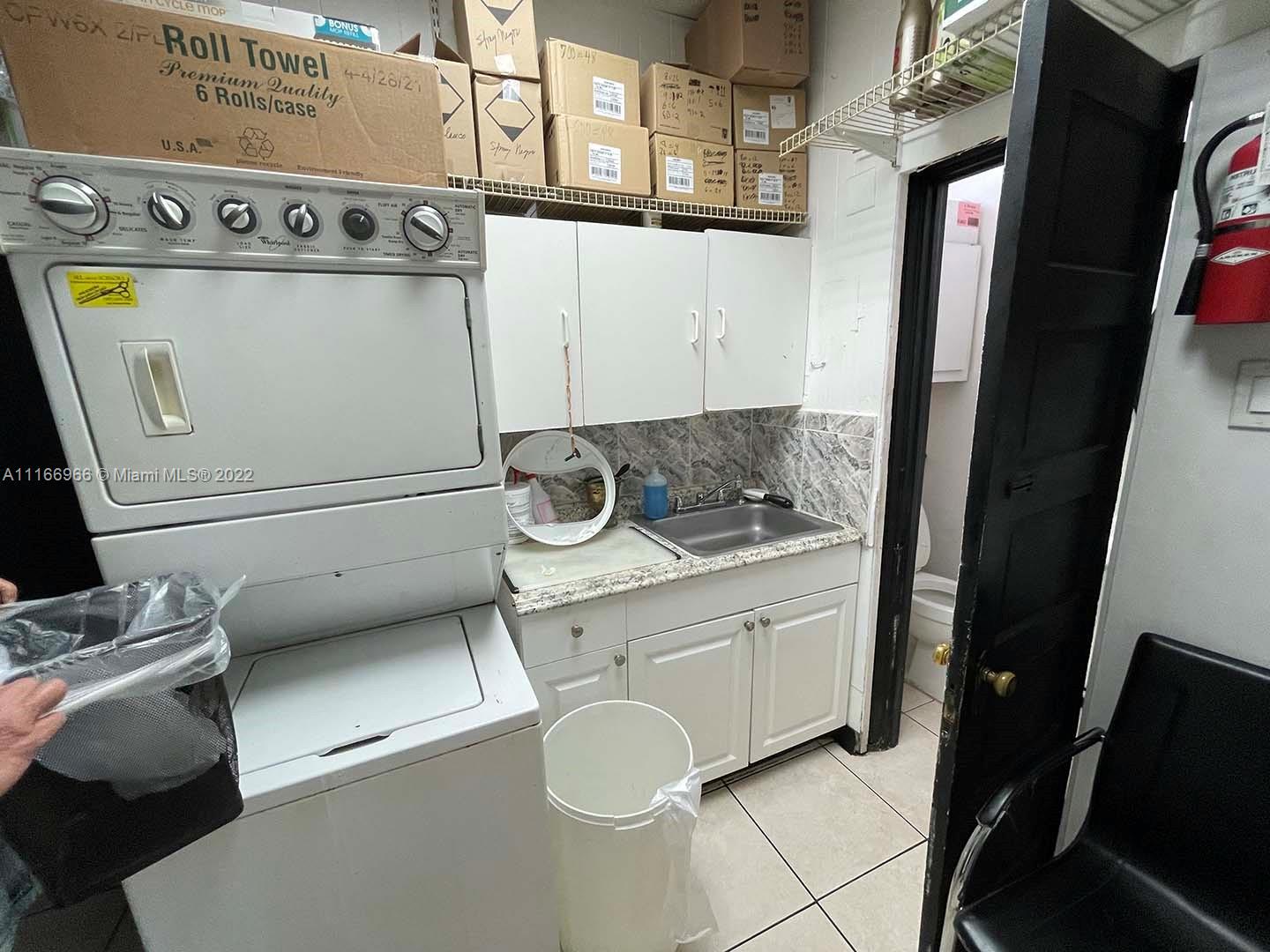 Miami Miami, FL 33135 - Photo 12 of 14 a bathroom with a granite countertop sink and a washing machine