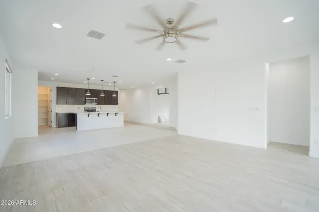 a view of a kitchen with a sink and a stove top oven