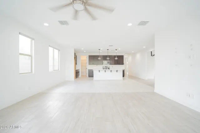 a view of a kitchen with a sink and a window
