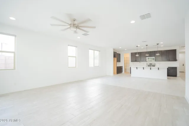 a view of a kitchen with a sink hardwood floor and a window