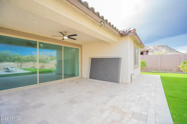 a view of a house with a yard and entertaining space