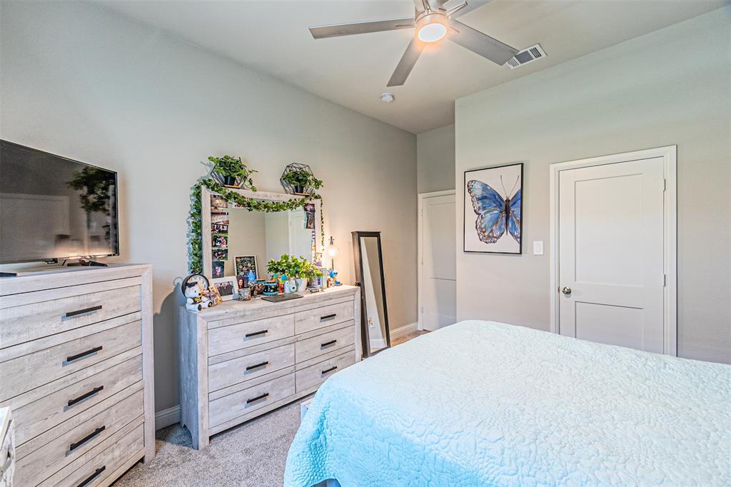 1009 Henry Way Springtown, TX 76082 - Photo 29 of 40 Bedroom featuring light carpet and ceiling fan