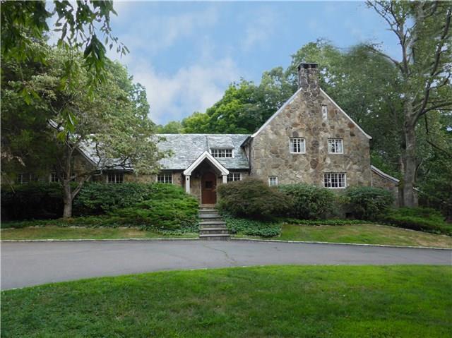 80 Chestnut Hill Road Wilton, CT 06897 - Photo 1 of 1 a front view of a house with a yard and garage