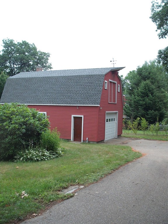 171 Maple Avenue Rutland, MA 01543 - Photo 3 of 25 a view of a yard in front of a house with a large tree