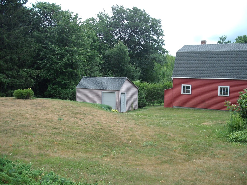 171 Maple Avenue Rutland, MA 01543 - Photo 4 of 25 a view of a house with a yard