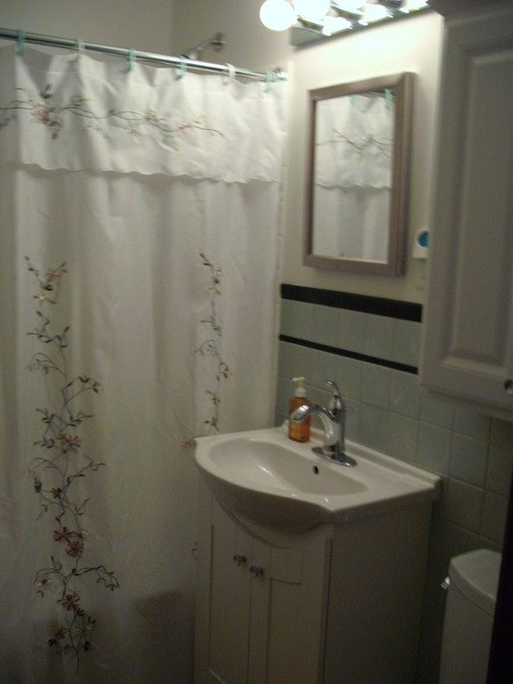 171 Maple Avenue Rutland, MA 01543 - Photo 8 of 25 a bathroom with a sink and a mirror