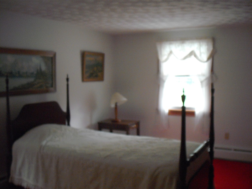 171 Maple Avenue Rutland, MA 01543 - Photo 9 of 25 a bedroom with a bed and a window